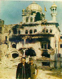 Hindu Soldiers of Indian Government posing in front of damaged Sri Akal Takht Sahib. 